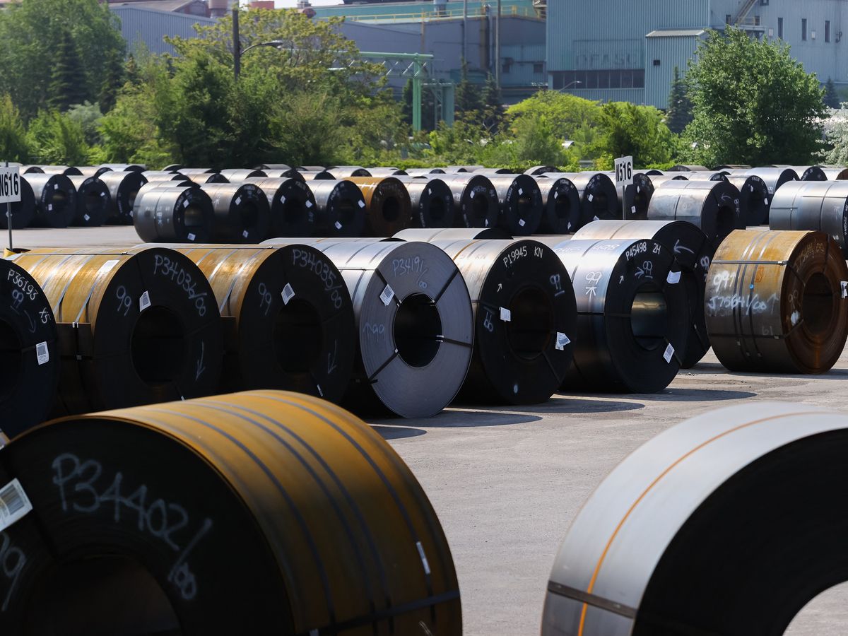 Coils of steel are seen in a yard outside one of ArcelorMittal Dofasco's steel manufacturing buildings in Hamilton on June 4, 2025.