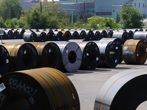 Coils of steel are seen in a yard outside one of ArcelorMittal Dofasco's steel manufacturing buildings in Hamilton on June 4, 2025.