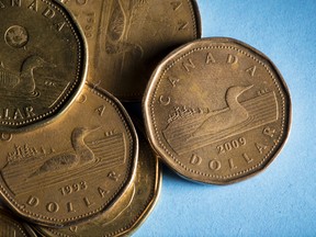 Canadian one dollar coins, also known as Loonies, are arranged for a photograph in Toronto, Ontario, Canada, on Wednesday, July 25, 2018.