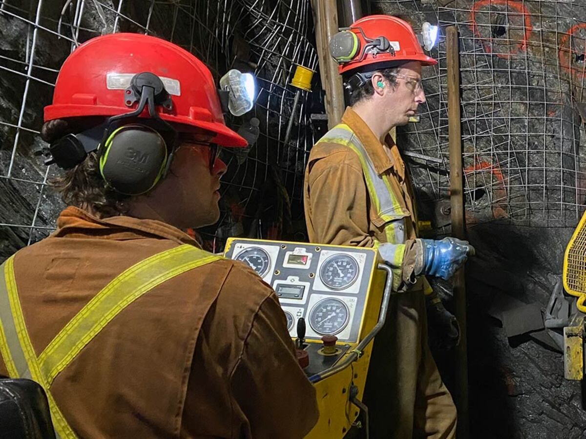 Two miners dig in a copper mine in Baie Verte, Newfoundland