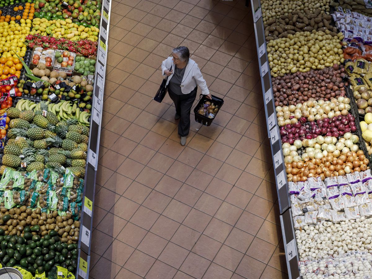 A shopper browses produce at a Loblaw Cos. grocery store in Toronto on April 30, 2019.