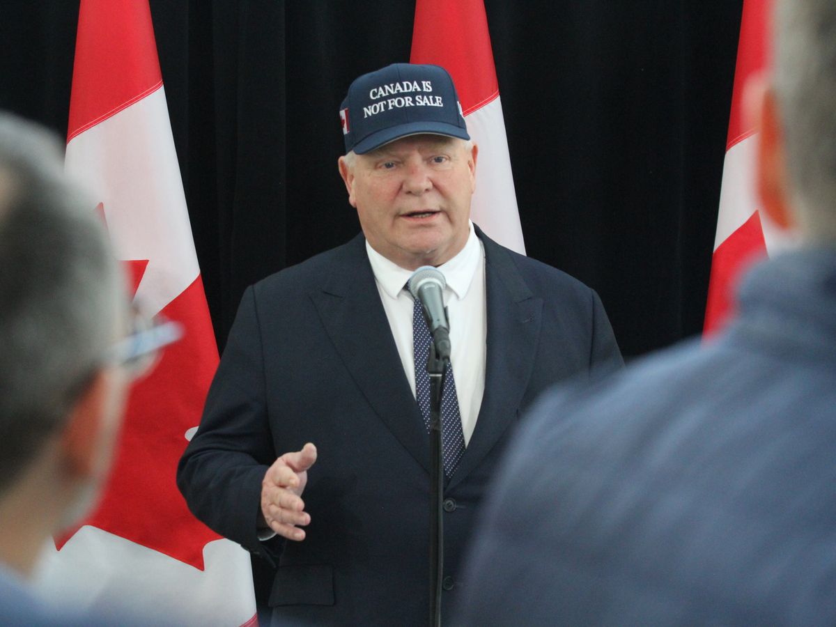 Ontario Premier Doug Ford wears a 'Canada is not for sale' hat to meetings with the country's premiers in Ottawa.
