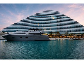 Beno's guest lounge on the marina promenade at Marsa Al Arab, Dubai, with the 115-ft yacht Santorini berthed opposite
