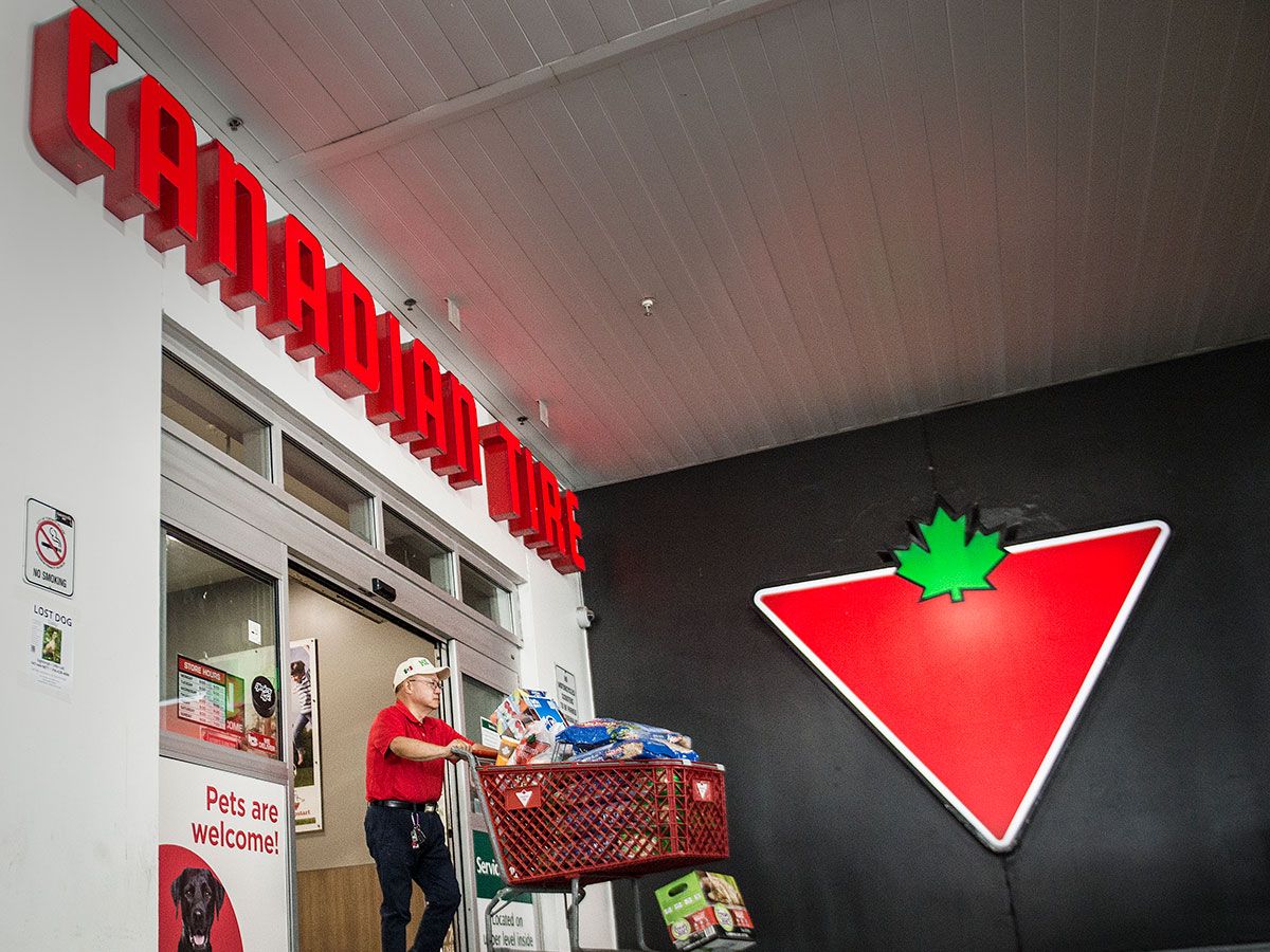 A shopper leaves a Canadian Tire in Toronto. Retail sales in Canada increased in June.