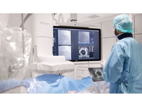 Clinician and patient with Azurion and IntraSight