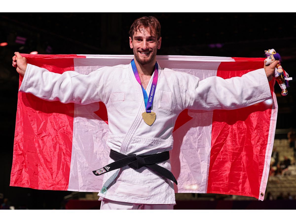 Flag Bearer Julian Frascadore with his gold medal