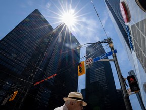 A pedestrian at Bay and King streets in the financial district in Toronto.