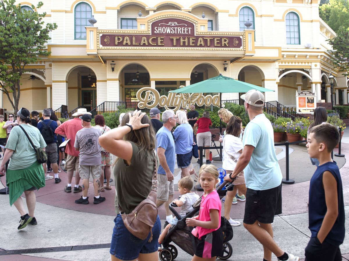 Guests attend Dollywood theme park on Wednesday in Pigeon Forge, Tenn.