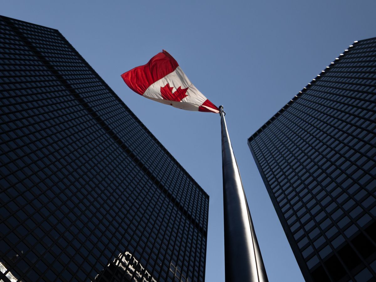 The Canadian flag flying between the TD Centre towers in the financial district in Toronto, Ontario on Tuesday, July 14, 2026.