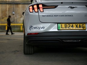 Details of a car from British autonomous driving technology company Wayve Technologies Ltd are pictured on the sidelines of London Tech Week in London on June 8, 2026. Uber and British start-up Wayve launched their commercial robotaxi service in London on September 3, 2026, although passengers will still have a human supervisor behind the wheel.
