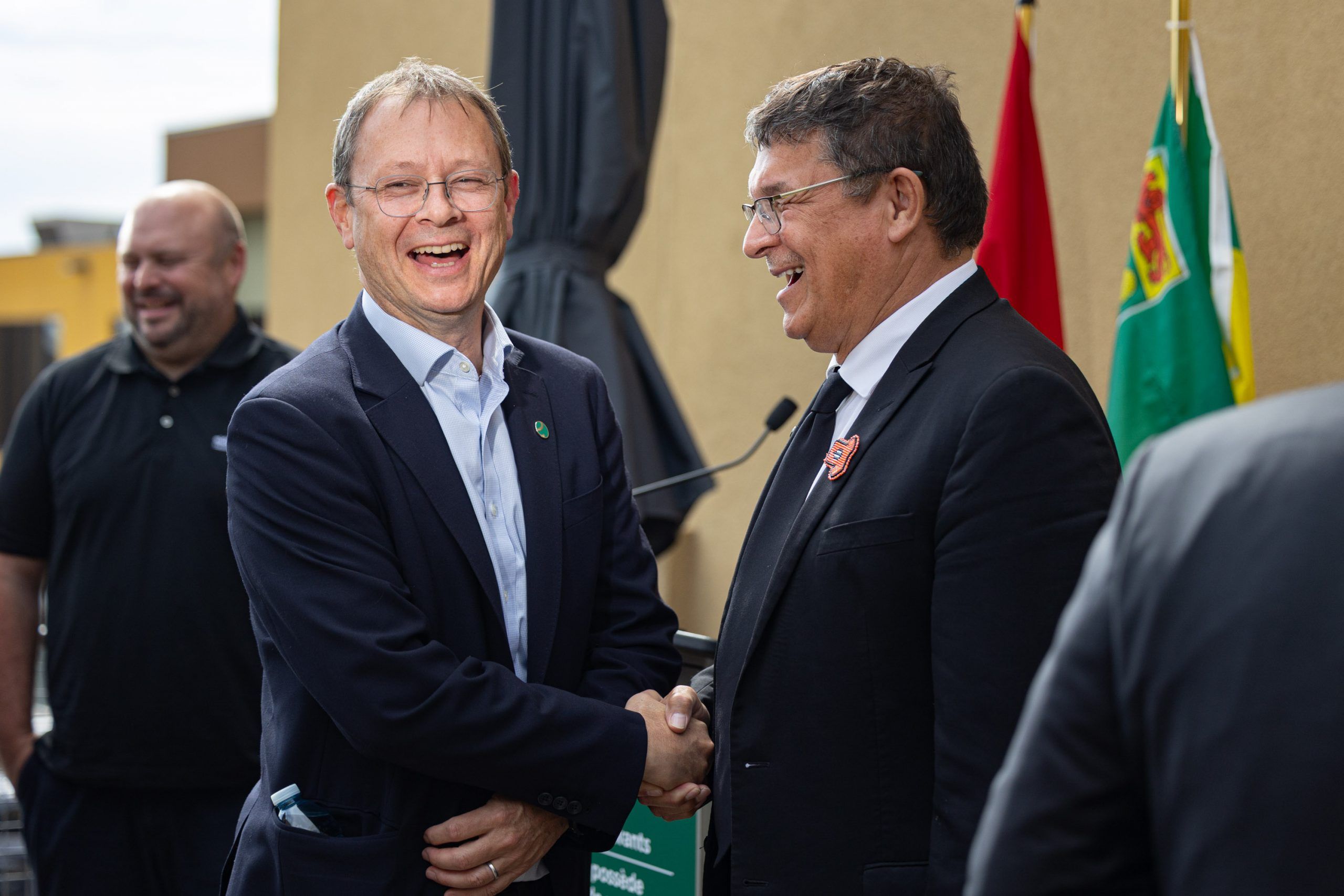 Eldorado Gold president Christian Milau, left, and Secretary of State for Rural Development Buckley Belanger share a laugh during a critical minerals update at the Eldorado Gold Saskatchewan offices. Photo taken in Saskatoon, Sask. on Wednesday September 2, 2026. (Michelle Berg / Saskatoon StarPhoenix)