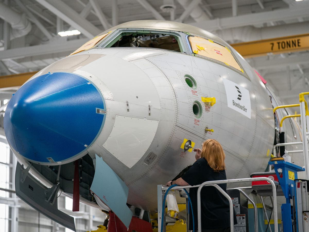 A worker assembles a Bombardier Global aircraft during a tour of the company's facility in Mississauga on May 8, 2026.