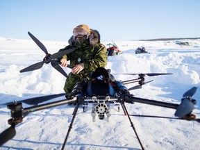 A Canadian soldier dismantles a drone as a team from the Canadian Navy test thermal imaging drone capabilities in Arctic environments, during Operation Nanook, the Canadian Armed Forces' annual Arctic training and sovereignty operation, in Inuvik, Northwest Territories, Canada, February 27, 2025.