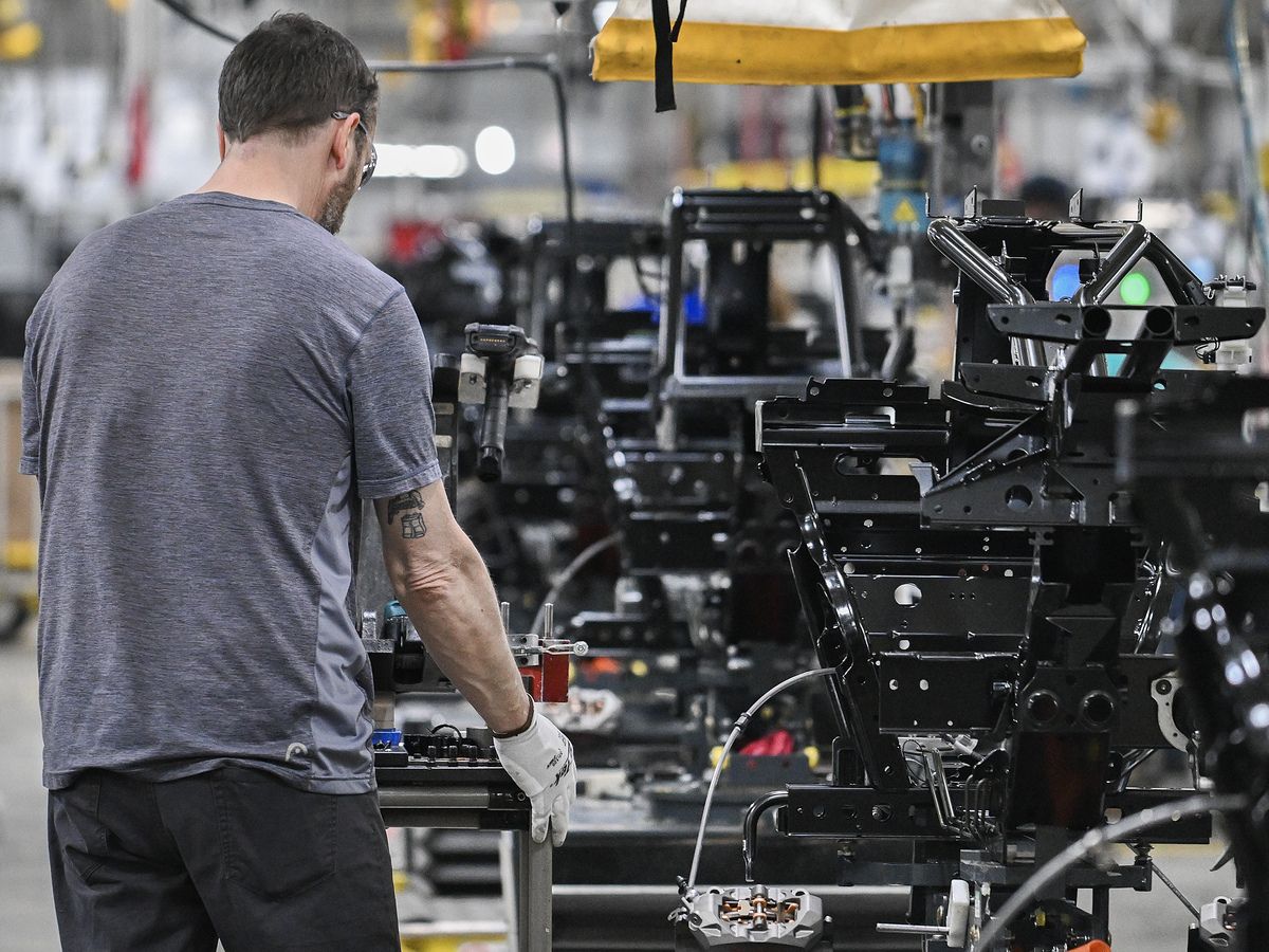 A worker assembles Can-Am 3-Wheel vehicles at a BRP manufacturing facility in Valcourt, Quebec, Canada, on Feb. 22, 2024.