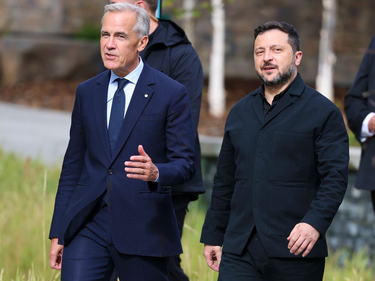 Prime Minister Mark Carney and Ukrainian President Volodymyr Zelenskyy walk together after Zelenskyy spoke during a cabinet retreat at the Banff Centre in Banff on Sept. 10, 2026.