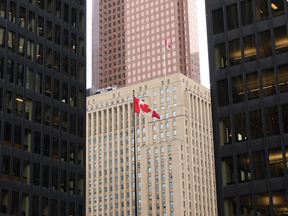 A Canadian flag flies in the financial district between the towers of the Toronto Dominion Center and the Bank of Nova Scotia on October 20, 2022, in Toronto, Canada.