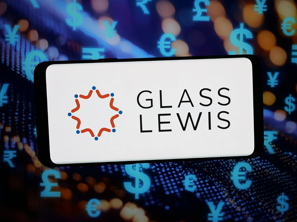 In this photo illustration, the logo of proxy advisory company Glass Lewis Co. is displayed on a smartphone in front of abstract background on computer screen.