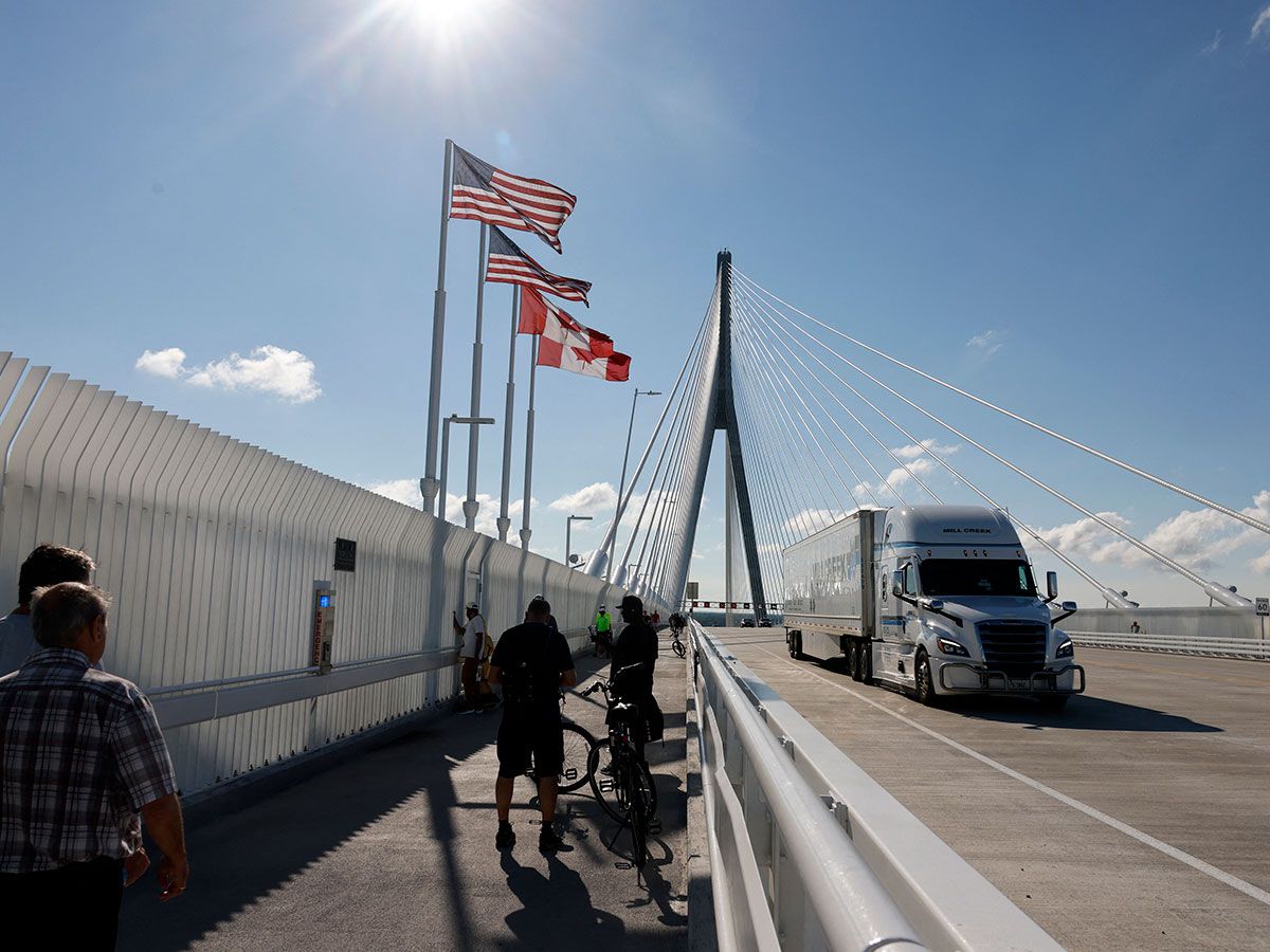 Trucks cross into the United States on the Gordie Howe International bridge that connects Windsor, Ont., and Detroit, Mich. Canada's economy stalled in July but picked up in August.