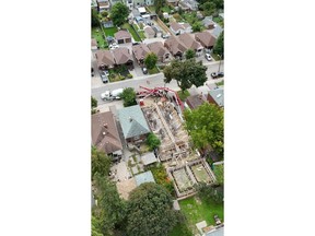 Aerial view of an active concrete pour at TUK Group's Lambton project in Toronto. A concrete pump and mixer truck sit on the street while crews place the foundation walls for the 10-unit rental building on a mid-block lot between existing homes. The site shows the project's scale relative to the surrounding residential street, illustrating TUK Group's approach of adding purpose-built rental homes within established Toronto neighbourhoods.