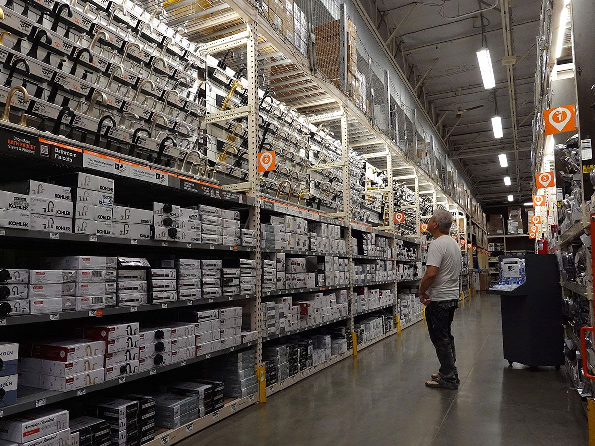 A shopper in Home Depot. Retail sales in Canada fell in July.