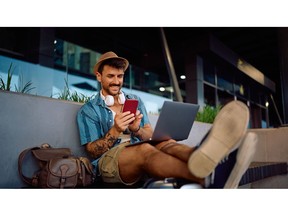 A traveler staying connected on the go. According to Holafly's Travel eSIM Value Index 2026, choosing an exact-day eSIM plan can save travelers up to 33% compared to fixed-duration packages.