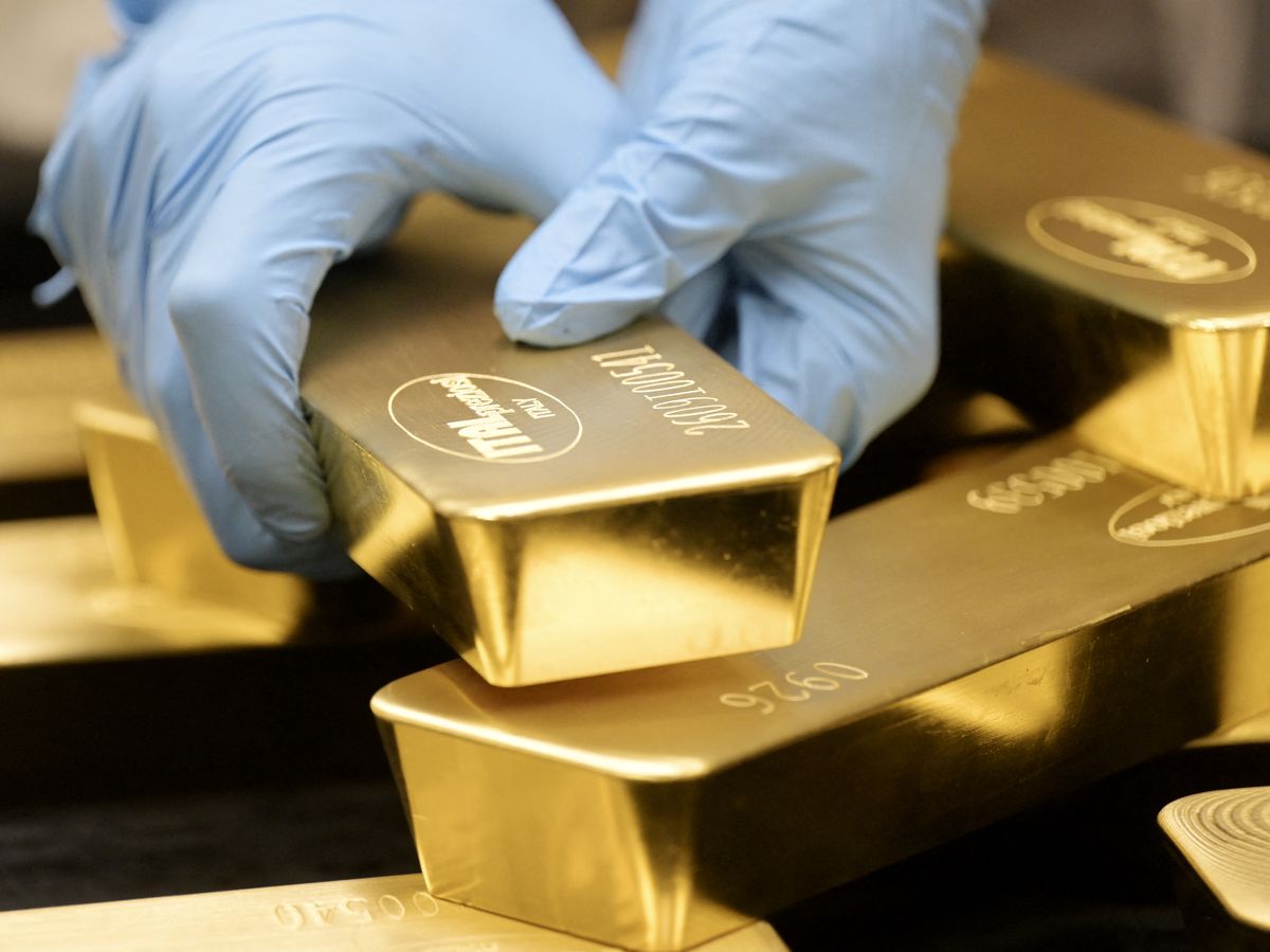 An employee arranges a 12,5kg gold bar at the Italpreziosi precious metals refinery in Arezzo, Italy, on September 29, 2026.