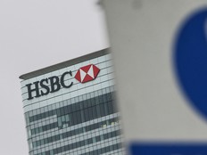 A sign is pictured in front of HSBC's London headquarters in the financial district Canary Wharf in London on February 21, 2017.