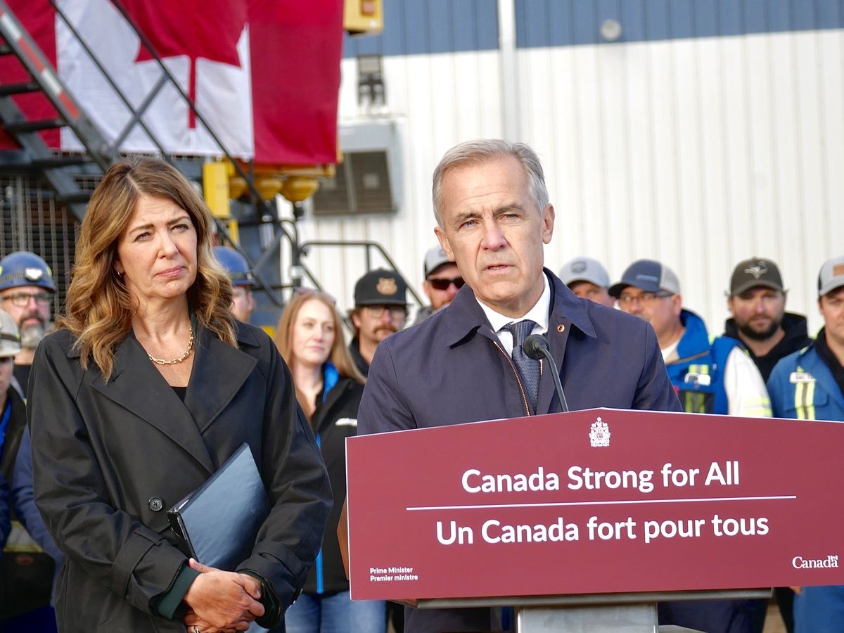 Alberta Premier Danielle Smith looks on while Prime Minister Mark Carney speaks during an announcement that the Pacific Link has been listed as a project of national interest, in Fort McMurray, Alta. on Thursday, Oct. 1, 2026.