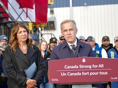 Alberta Premier Danielle Smith looks on while Prime Minister Mark Carney speaks during an announcement that the Pacific Link has been listed as a project of national interest, in Fort McMurray, Alta. on Oct. 1, 2026.