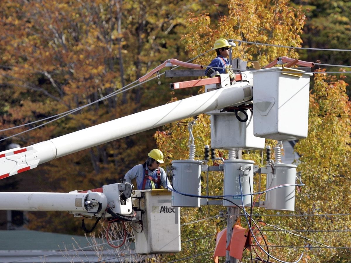 Emera line workers do maintenance work on Purcell's Cove Road in Halifax.