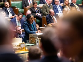 A handout photograph released by the U.K. Parliament's House of Commons shows Britain's main opposition Conservative Party leader Kemi Badenoch making a statement, in central London, on October 12, 20