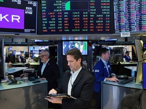 Traders work on the floor of the New York Stock Exchange during morning trading on May 01, 2026 in New York City