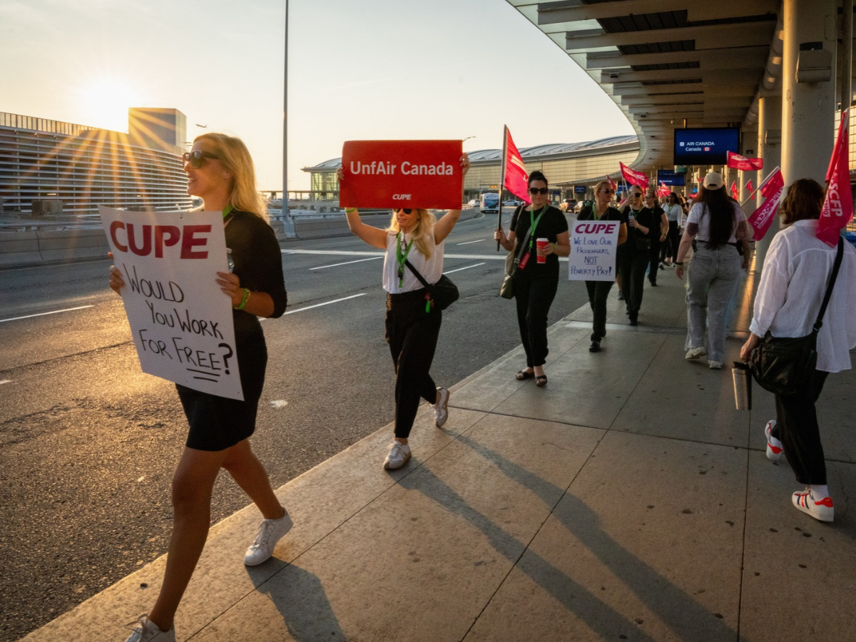 Air Canada flight attendants and supporters during a strike at Toronto Pearson International Airport in Mississauga, Ontario, Canada, on Saturday, Aug. 16, 2025