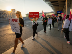 Air Canada flight attendants and supporters during a strike at Toronto Pearson International Airport in Mississauga, Ontario, Canada, on Saturday, Aug. 16, 2025