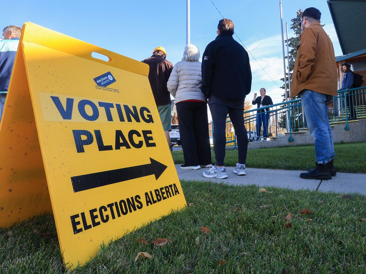 Voters line up to vote in the advance poll for the 2026 Alberta Referendum at the Scandinavian Centre in Calgary on Tuesday, October 13, 2026.