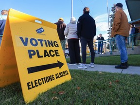 Voters line up to vote in the advance poll for the 2026 Alberta Referendum at the Scandinavian Centre in Calgary on Tuesday, October 13, 2026.