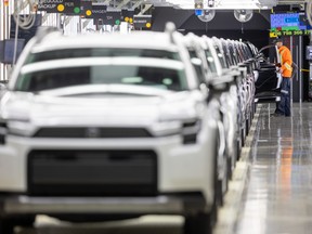 Workers inspect the 2026 Rav4 at the final inspection bay at Toyota’s assembly plant in Woodstock during a press reveal on Friday January 23, 2026.