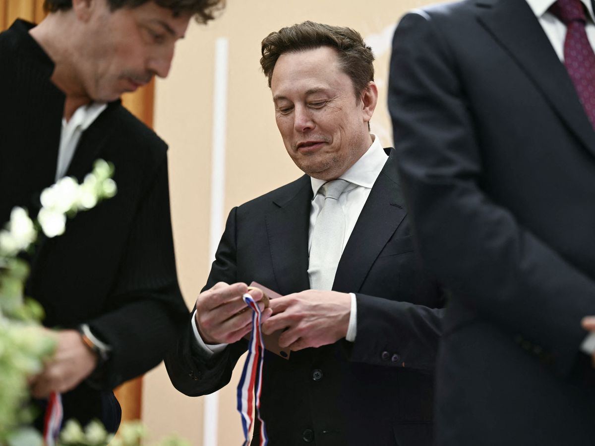 Elon Musk reacts after being awarded the National Medal of Science during the 