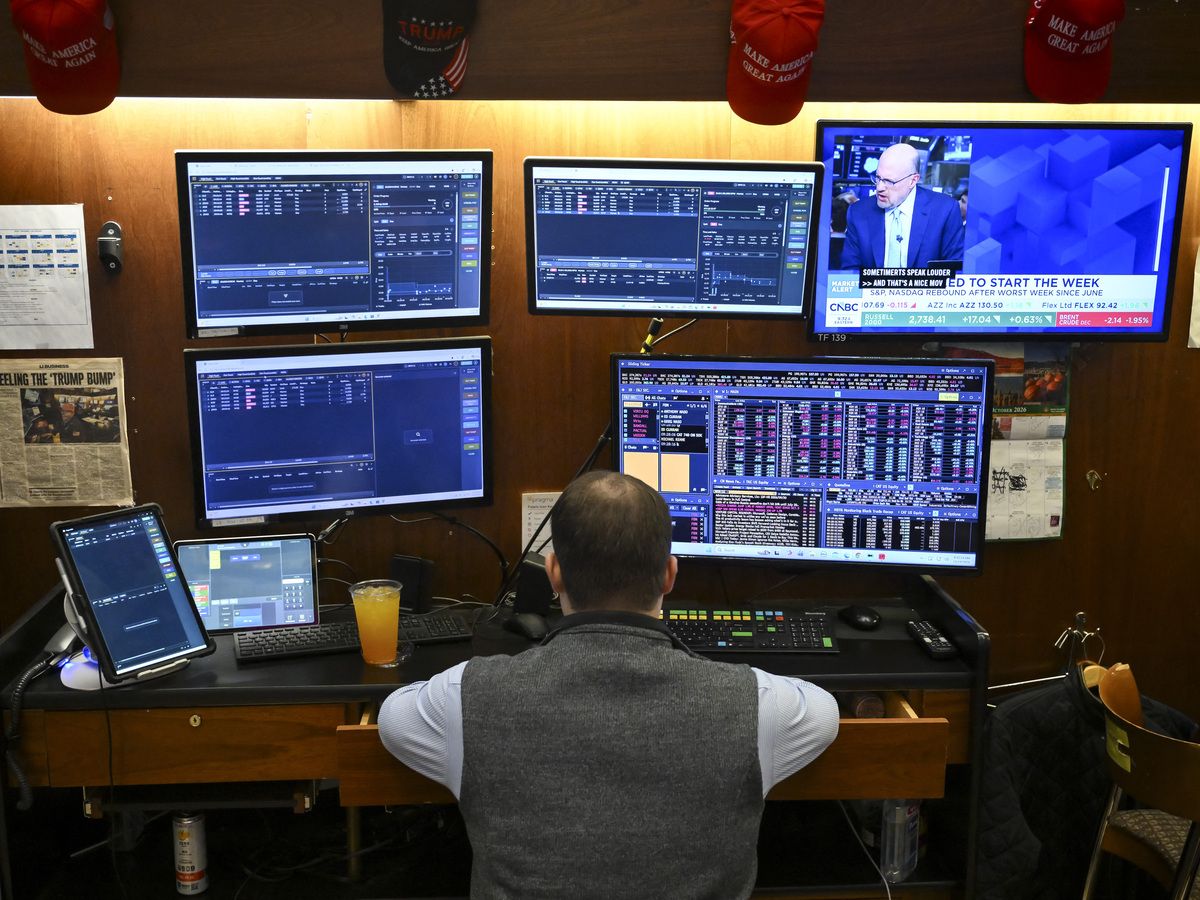 A trader works on the floor of the New York Stock Exchange (NYSE) at the opening bell in New York City on October 19, 2026.