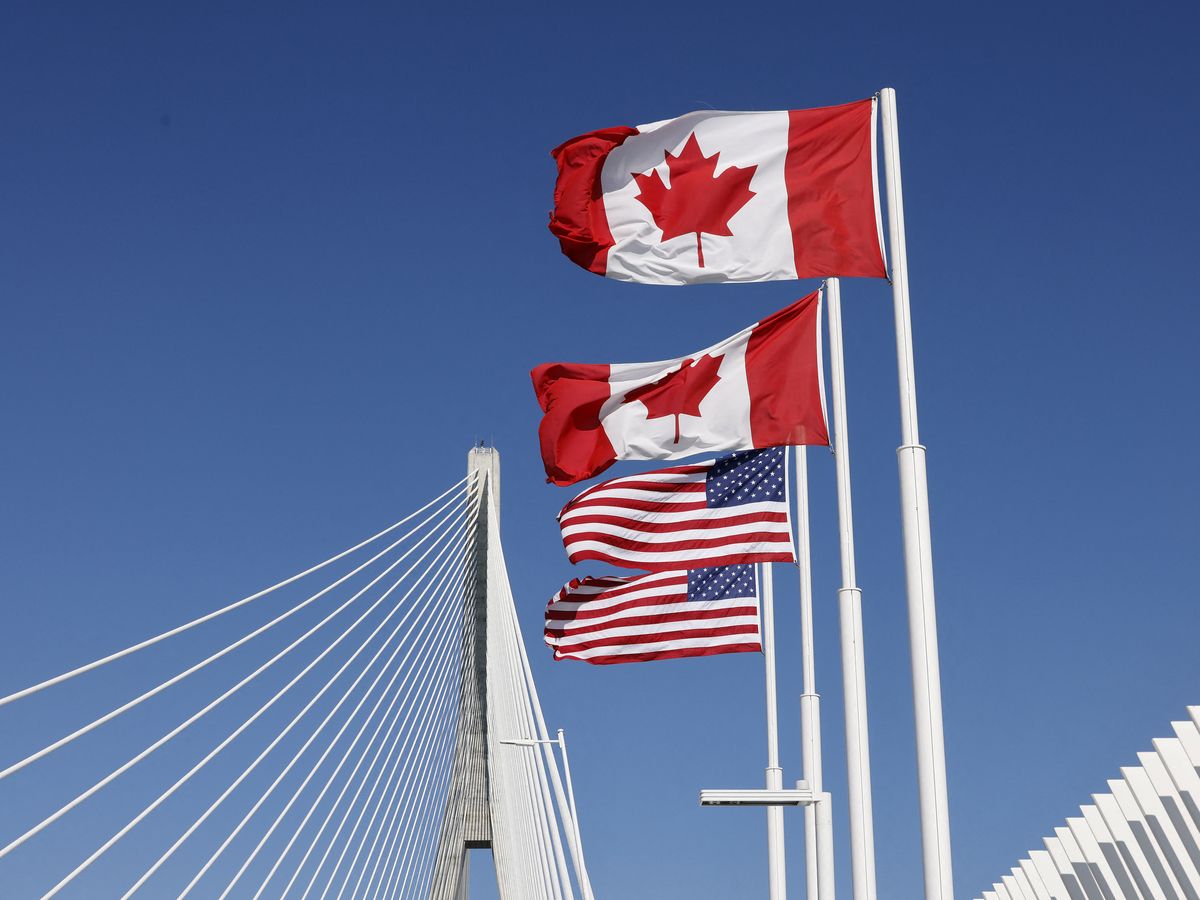 Flags of Canada and United States fly across the international border on the Gordie Howe International bridge that connects Windsor, Ontario, Canada and Detroit, Michigan on September 6, 2026.