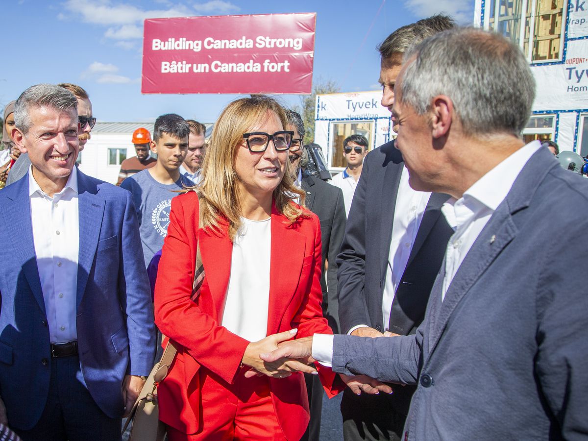 Ana Bailão, Chief Executive Officer of Build Canada Homes, greet the prime minister after the press conference Sunday.