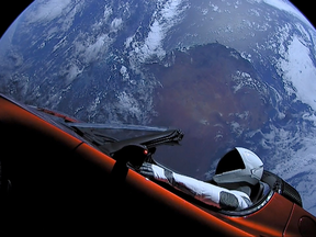 : In this handout photo provided by SpaceX, a Tesla roadster launched from the Falcon Heavy rocket with a dummy driver named