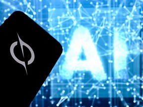 A photo taken on May 13, 2026 shows the letters AI for Artificial Intelligence on a laptop screen (R) next to the logo of the SpaceX' Grok Chatbot application on a smartphone screen in Frankfurt am Main, western Germany.