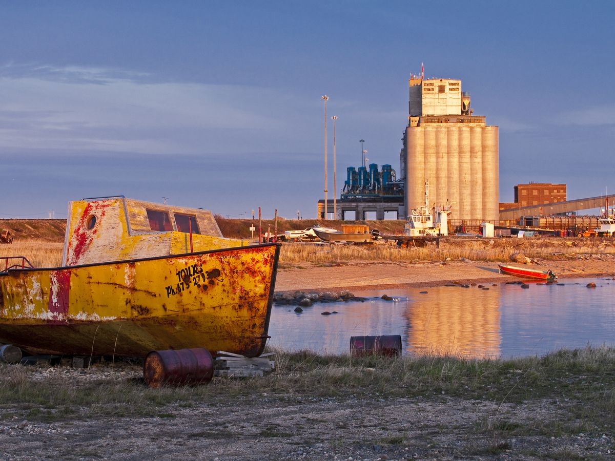 An old boat sits on the shore, Port of Churchill, Manitoba.