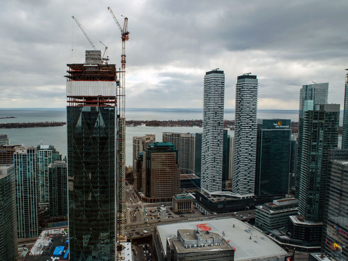 Cranes operate over the CIBC Square construction site in Toronto on Feb. 19, 2020.