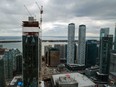 Cranes operate over the CIBC Square construction site in Toronto on Feb. 19, 2020.
