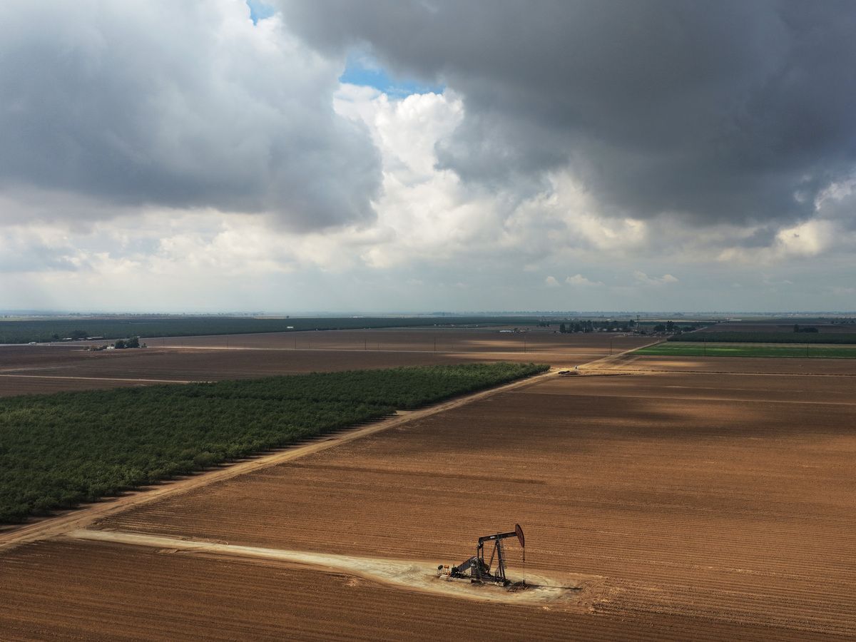 An aerial view of a pumpjack operating amid agricultural fields in Kern County, which has a long history of oil production, in California’s 22nd Congressional District on October 23, 2026 near Bakersfield, California.