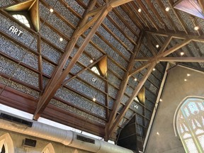 The ceiling of Church and Union Charleston, a South Carolina bar converted from an old church, with the text of Sun Tzu's The Art of War covering it.