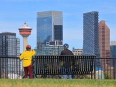 Cyclists stop to take in the view of the downtown Calgary skyline from Scotsman's Hill on September 1, 2026. Recent developments in the energy industry has resulted in an uptick in interest in office space.
