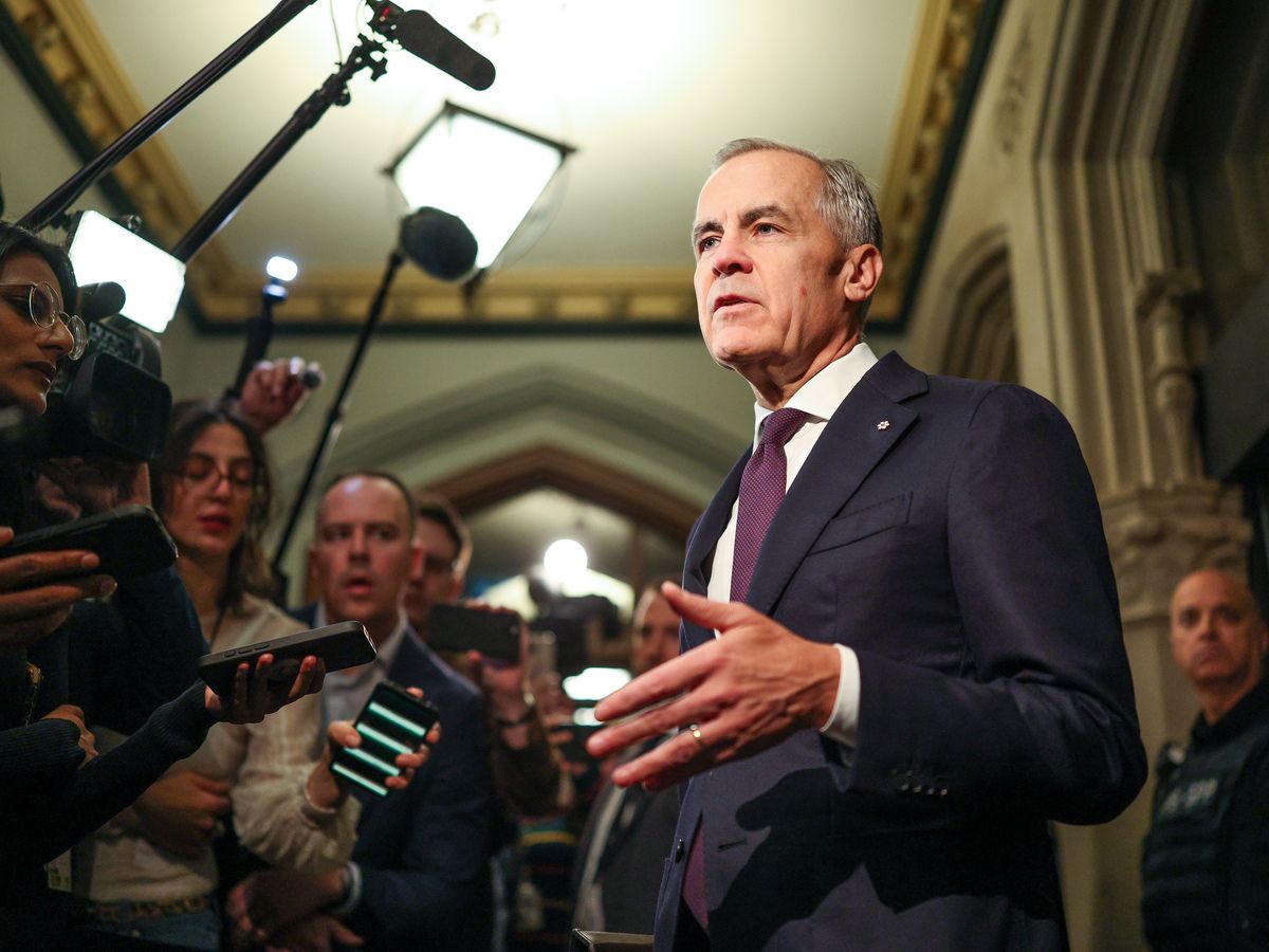Prime Minister Mark Carney speaks to journalists before chairing Liberal Party caucus meeting at West Block on Parliament Hill in Ottawa on Oct. 21, 2026.